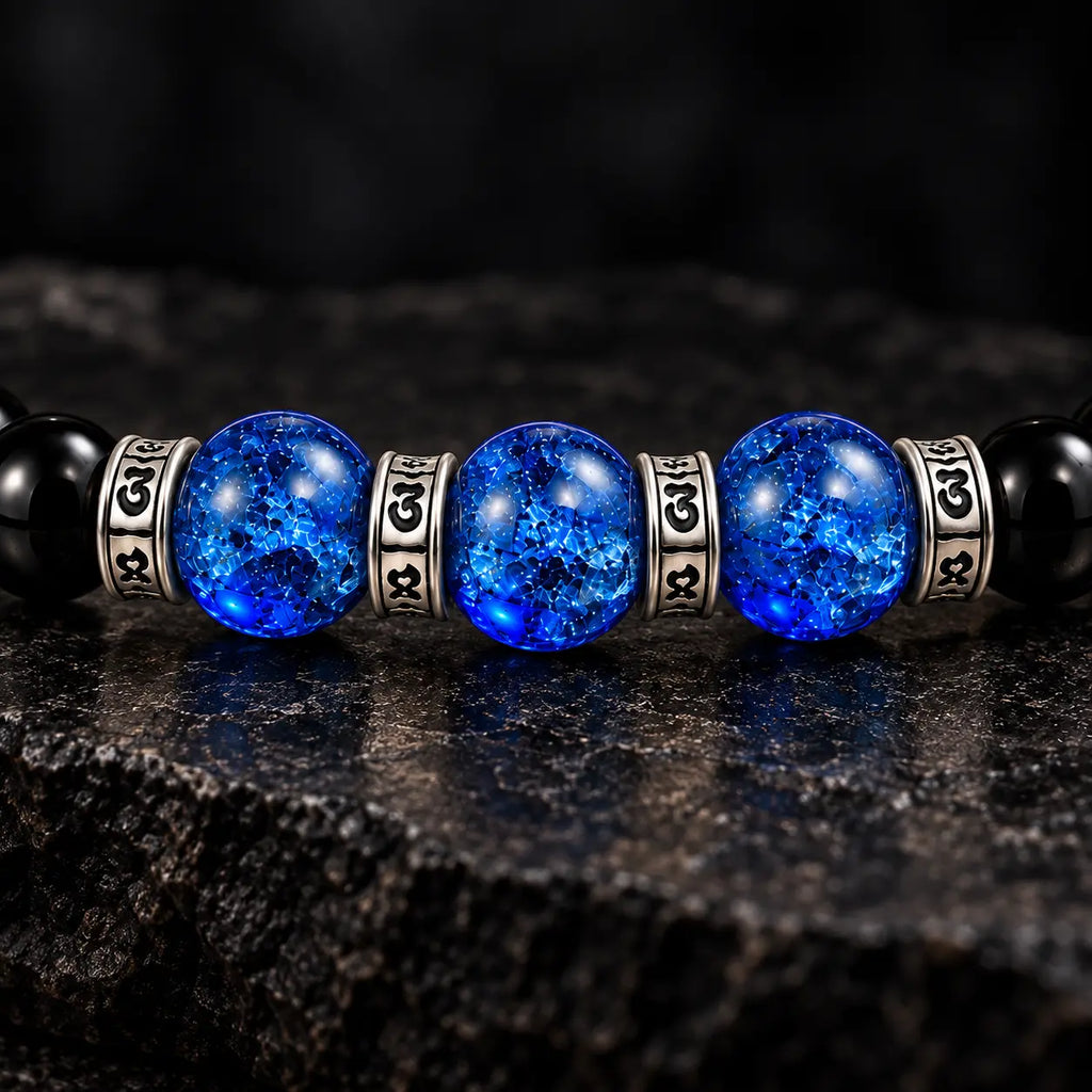 Three blue crackle Liuli beads framed by four S925 mantra rings