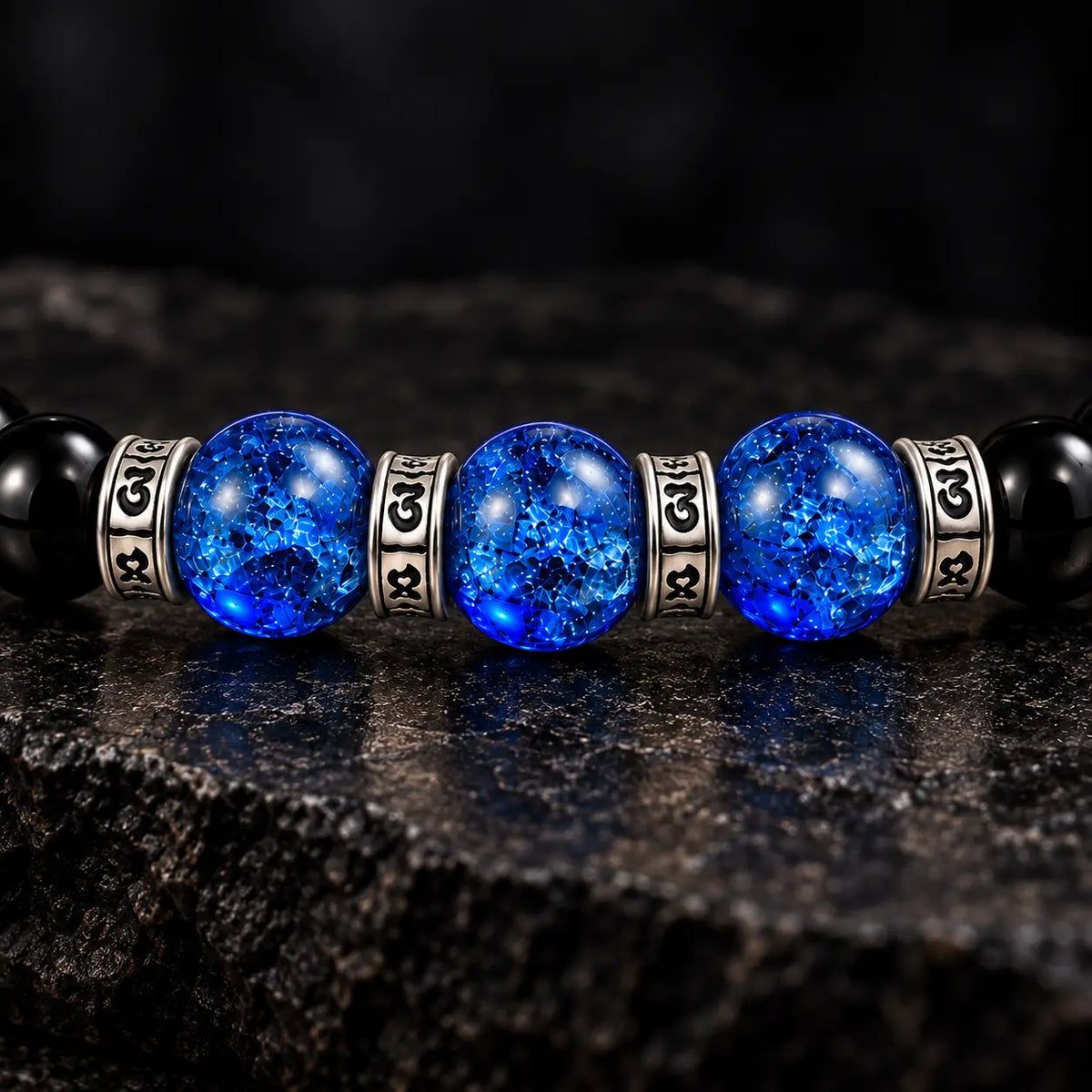 Three blue crackle Liuli beads framed by four S925 mantra rings
