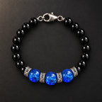 Top view of natural black obsidian and blue Liuli bracelet