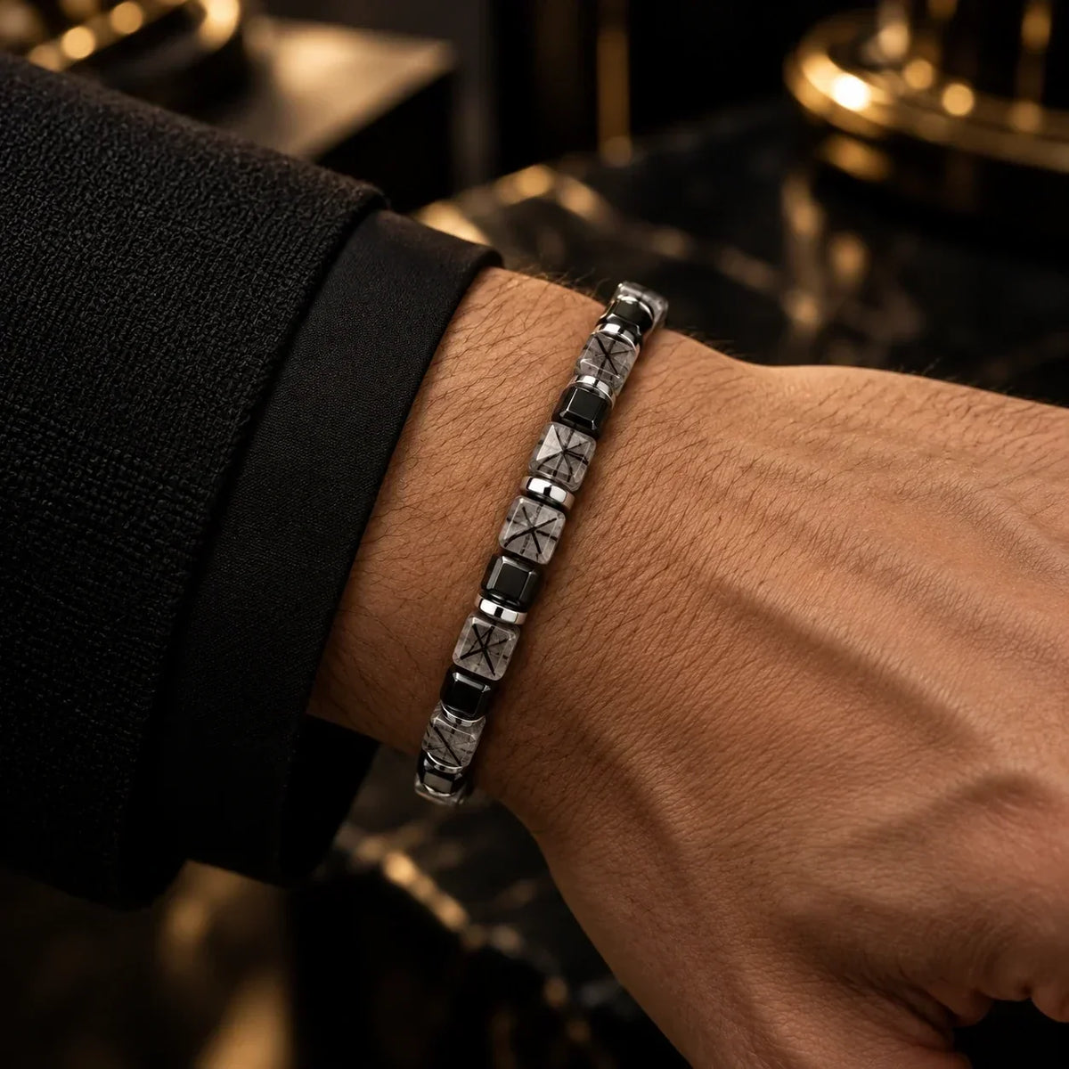 Angled view of black rutilated quartz bracelet with dark accent beads and S925 silver details