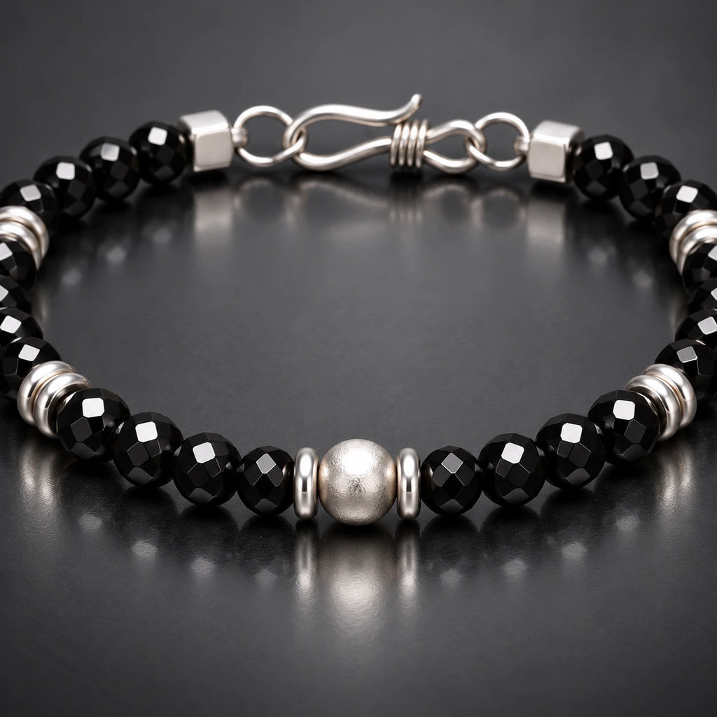Close-up black spinel facets and S925 silver center detail