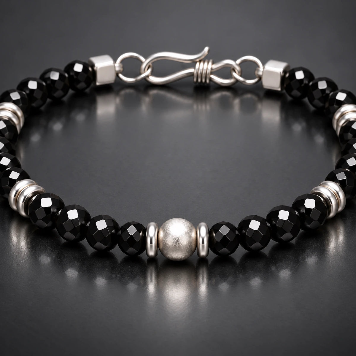 Close-up black spinel facets and S925 silver center detail