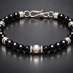 Close-up black spinel facets and S925 silver center detail