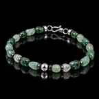 Angled view of natural freeform green agate bracelet with hematite spacers