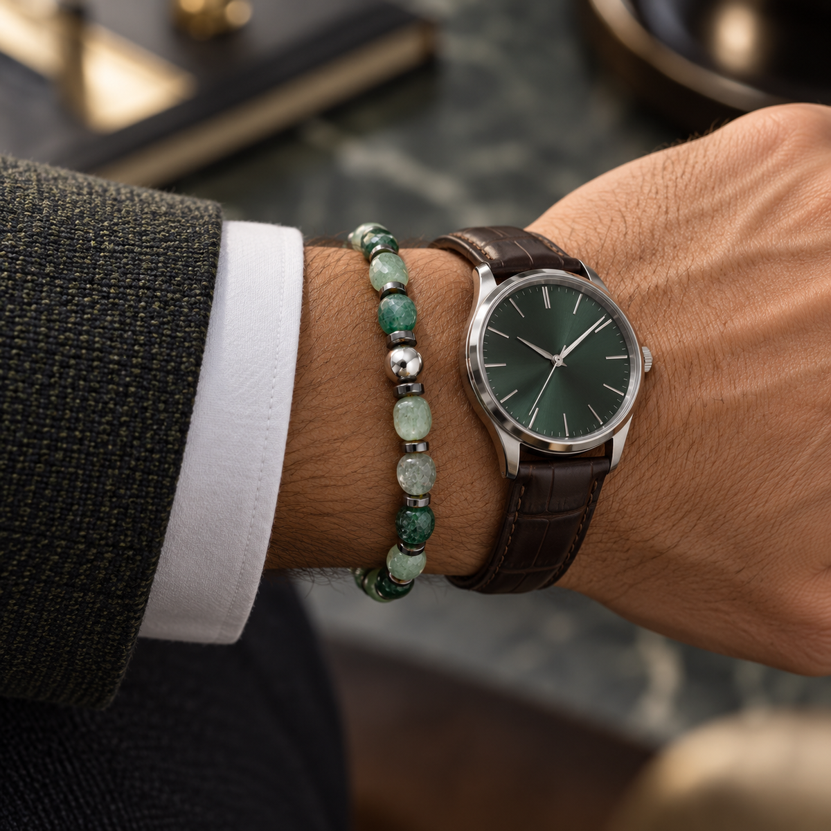 Natural green agate bracelet styled beside a watch