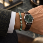 Natural green agate bracelet styled beside a watch