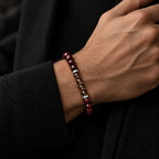 Red tiger eye and smoky quartz bracelet worn on wrist