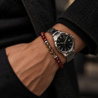 Red tiger eye and smoky quartz bracelet styled beside a watch