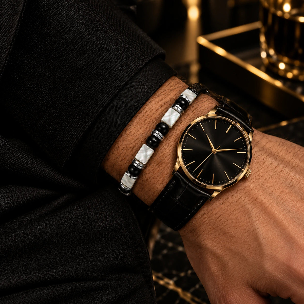 L&X mother-of-pearl obsidian bracelet styled with a black and gold watch