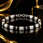 Angled view of L&X mother-of-pearl obsidian bracelet with S925 silver details