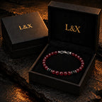 Natural garnet and black obsidian bracelet presented in the black L&X jewelry box.