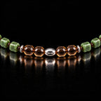 Close view of four faceted smoky quartz beads and the S925 olive-shaped centre bead.