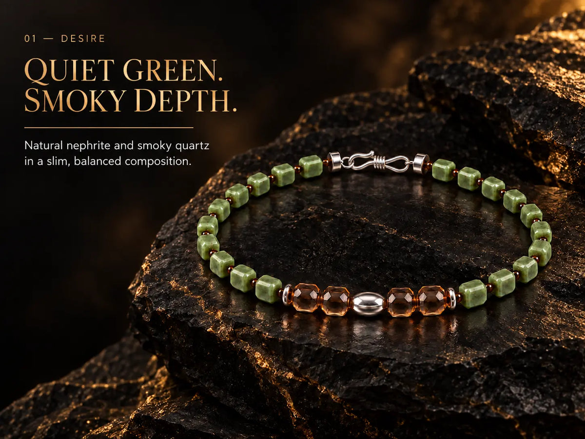 Natural nephrite and smoky quartz bracelet on black stone with warm gold light.