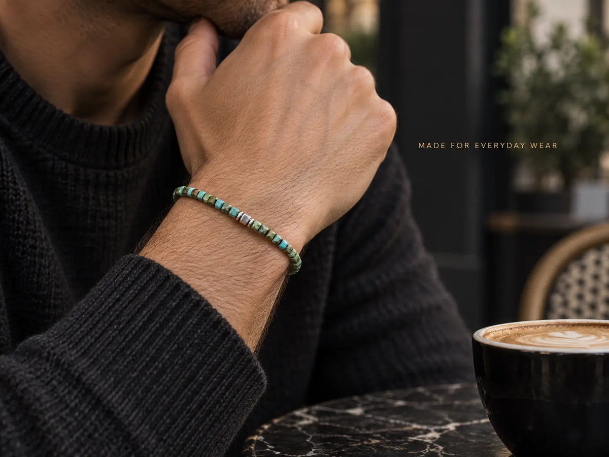 Natural turquoise cube bracelet worn in a relaxed everyday setting.