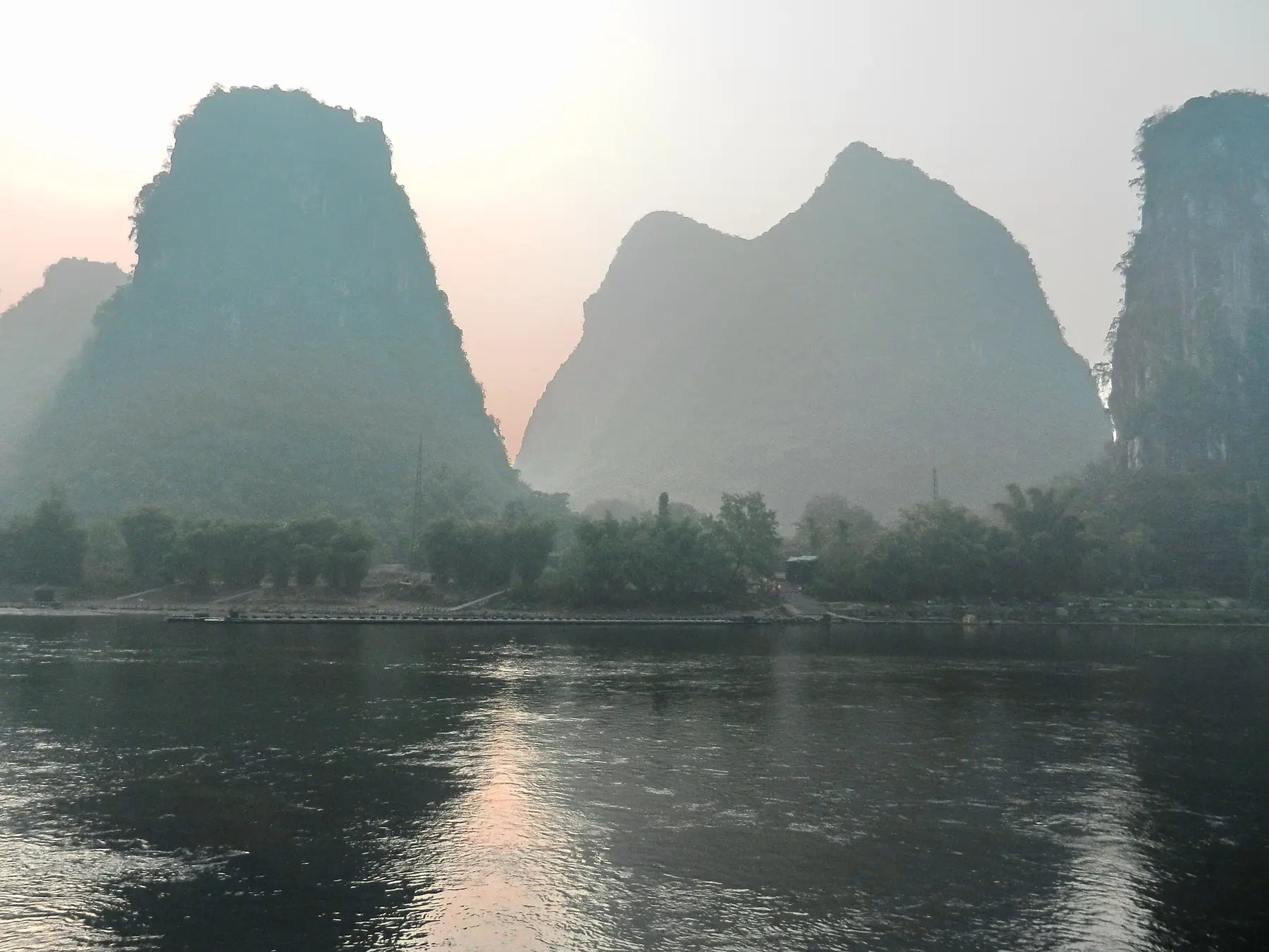 Karst mountains beside the Li River at dawn in Yangshuo